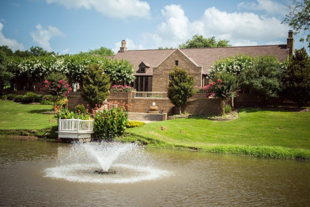33307 Whiting Street Fulshear, TX 77441 - Photo 5 of 6 a view of a house with a yard and a fountain