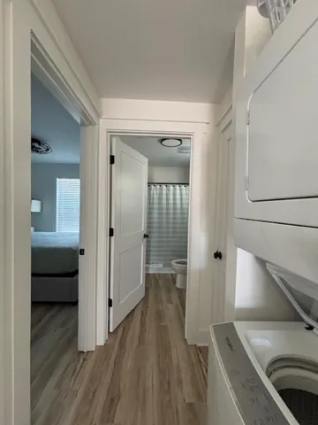 a view of a hallway view with wooden floor and furniture
