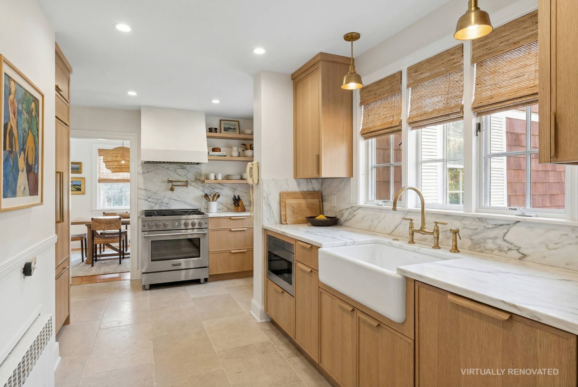 201 Herrick Road Southampton, NY 11968 - Photo 5 of 29 a kitchen with stainless steel appliances a stove sink and cabinets