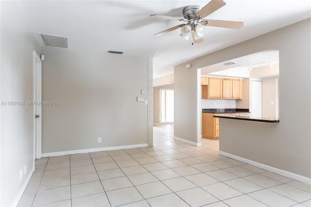 a view of a kitchen with a sink and cabinet area
