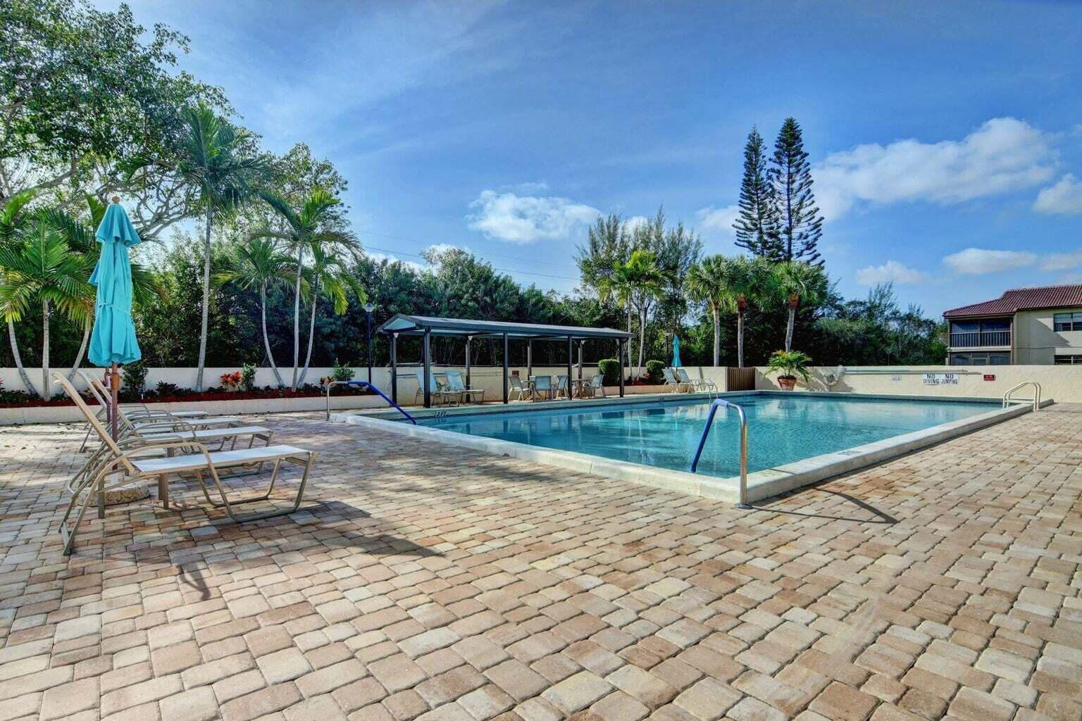 21851 Arriba Real, Unit 9J Boca Raton, FL 33433 - Photo 40 of 43 The Glades pool