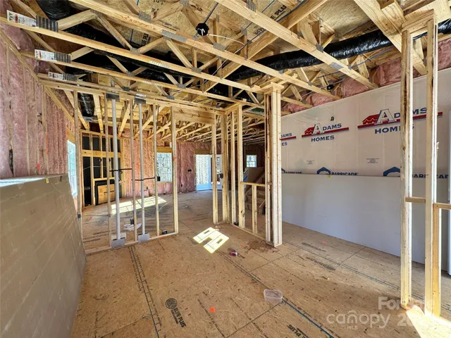 a view of a hallway with wooden walls