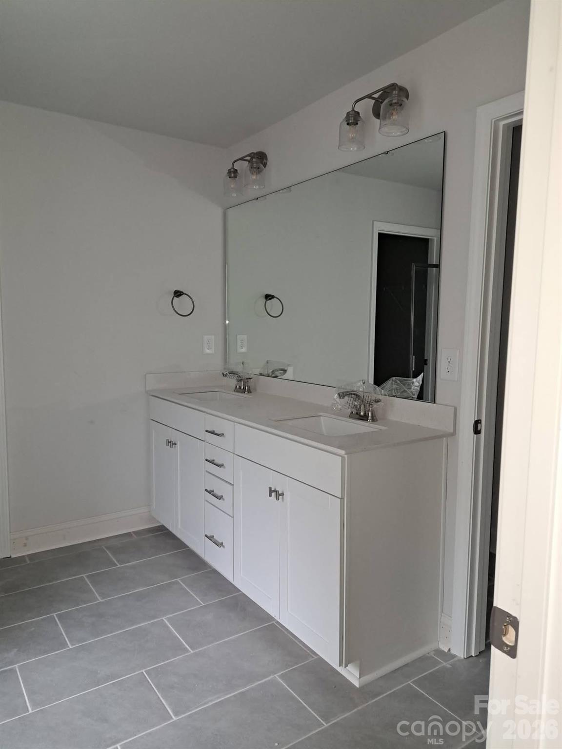 1590 Autumn Place, Unit 116 York, SC 29745 - Photo 17 of 28 a bathroom with a sink and a mirror