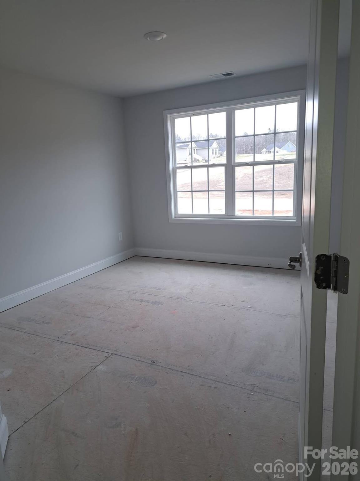 1590 Autumn Place, Unit 116 York, SC 29745 - Photo 23 of 28 a view of an empty room with a window