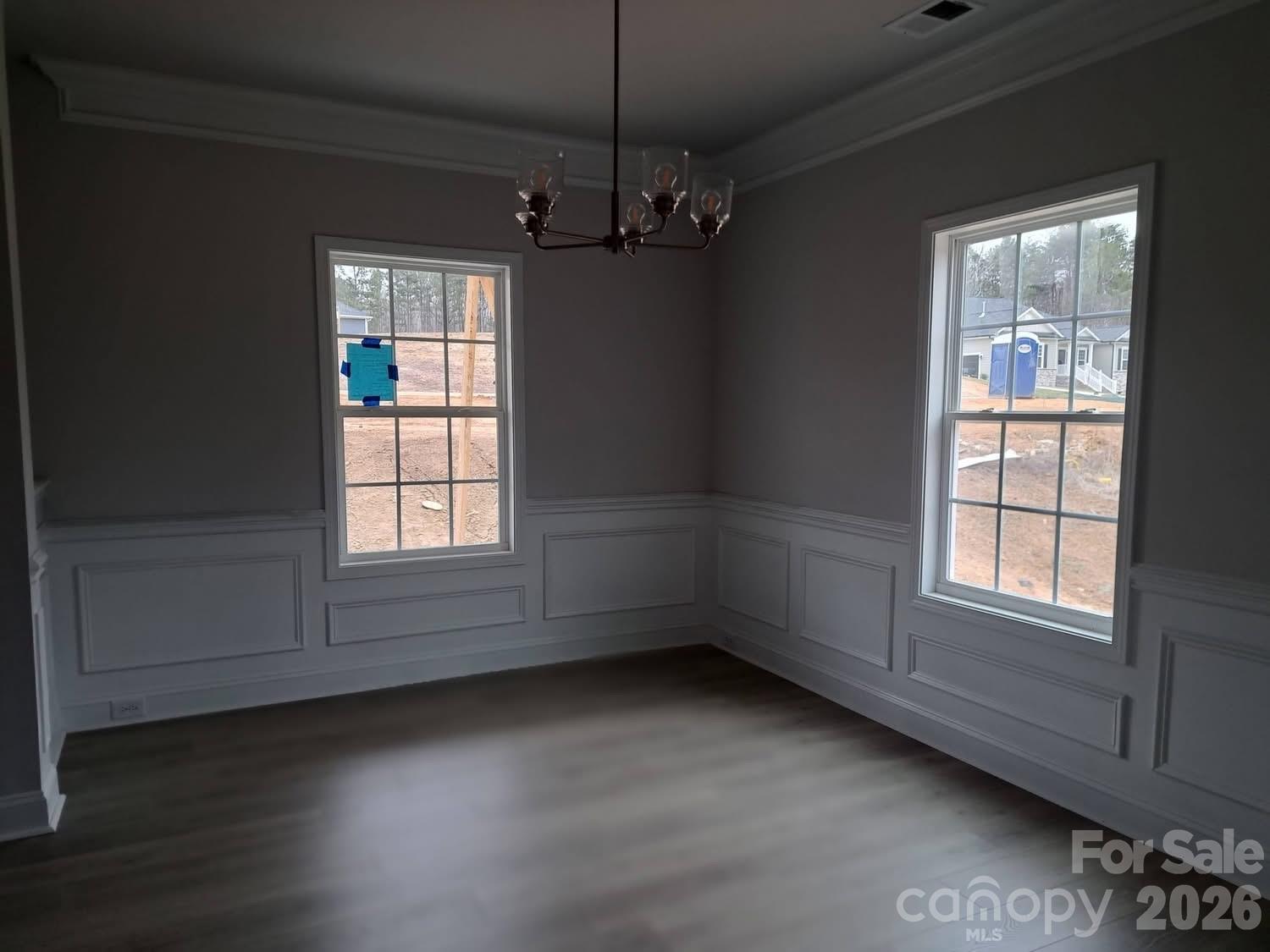 1590 Autumn Place, Unit 116 York, SC 29745 - Photo 7 of 28 an empty room with wooden floor and windows