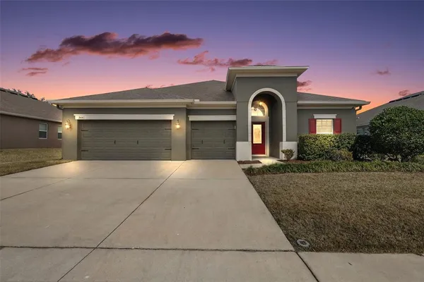 front view of a house with a yard