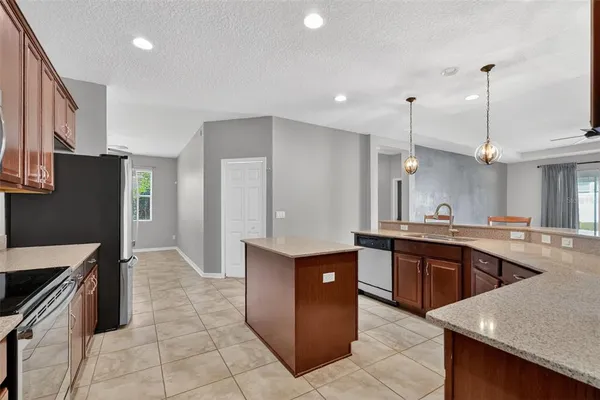 a kitchen with stainless steel appliances granite countertop a sink counter space cabinets and stainless steel appliances