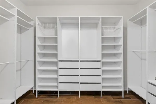a view of an empty walk in closet