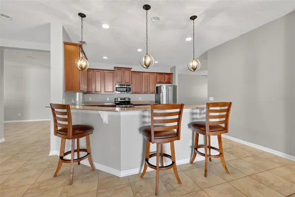 a room with cabinets and appliances