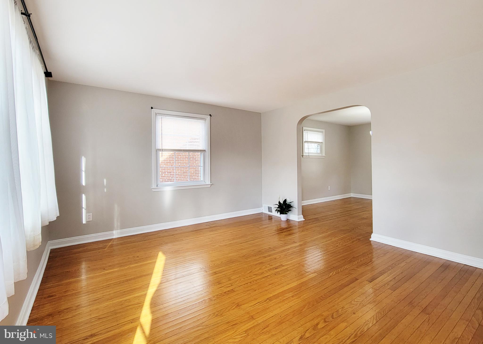 409 Perry Street Ridley Park, PA 19078 - Photo 29 of 66 an empty room with wooden floor and windows