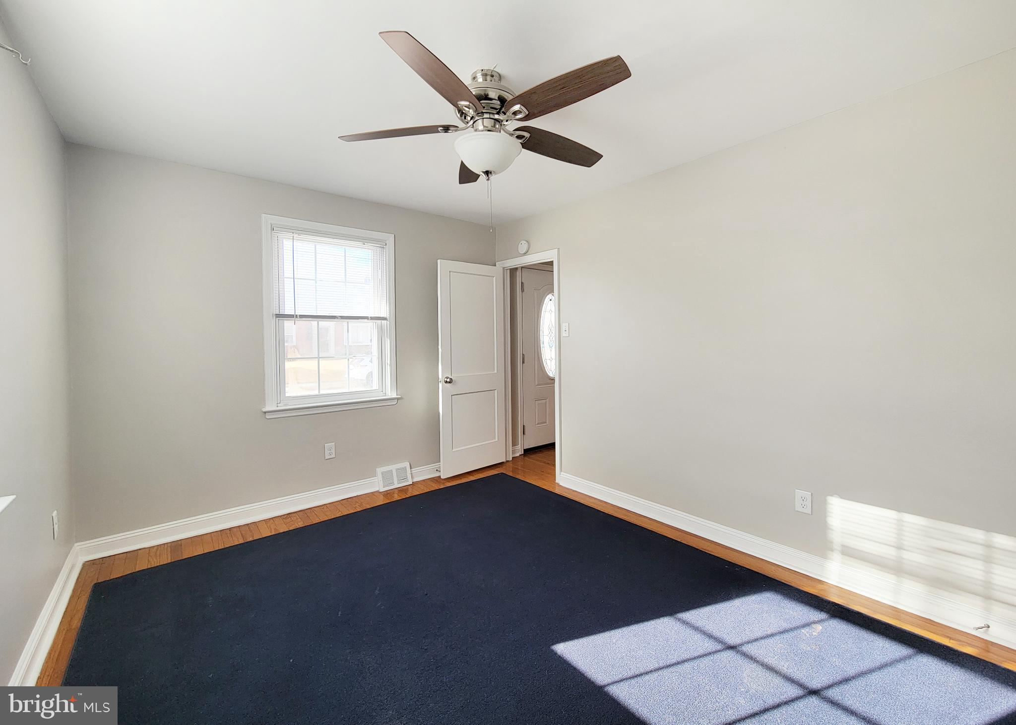 409 Perry Street Ridley Park, PA 19078 - Photo 33 of 66 an empty room with wooden floor and windows
