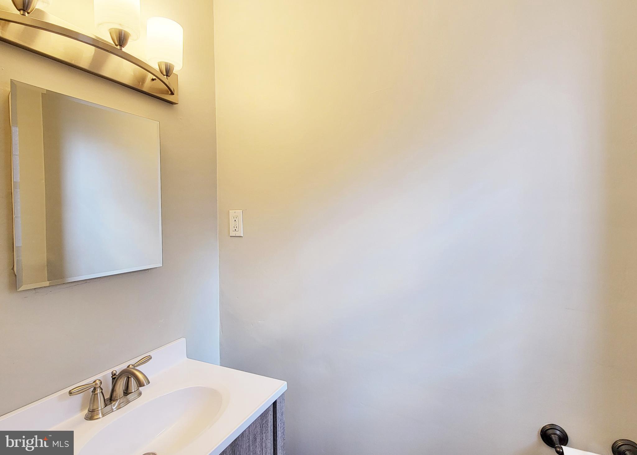 409 Perry Street Ridley Park, PA 19078 - Photo 34 of 66 a bathroom with a sink and a mirror