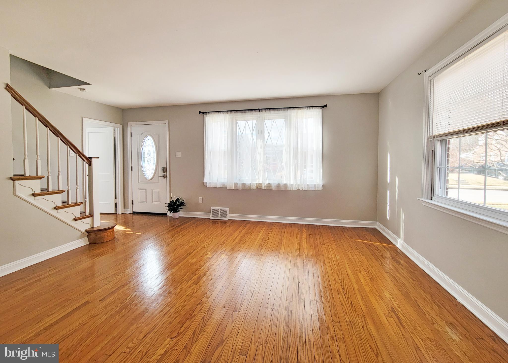 409 Perry Street Ridley Park, PA 19078 - Photo 37 of 66 an empty room with wooden floor and windows