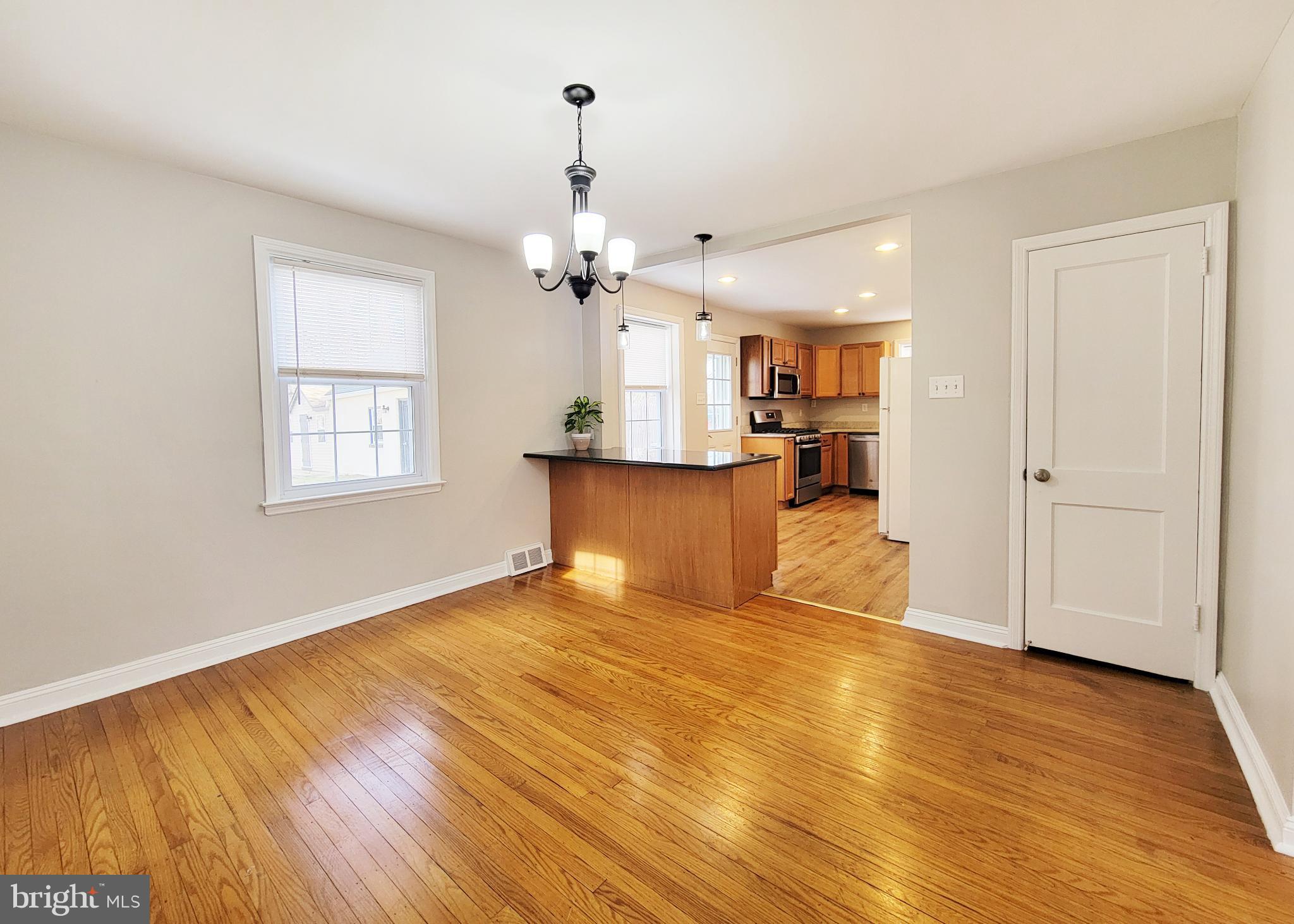 409 Perry Street Ridley Park, PA 19078 - Photo 38 of 66 a view of a kitchen with wooden floor and a window