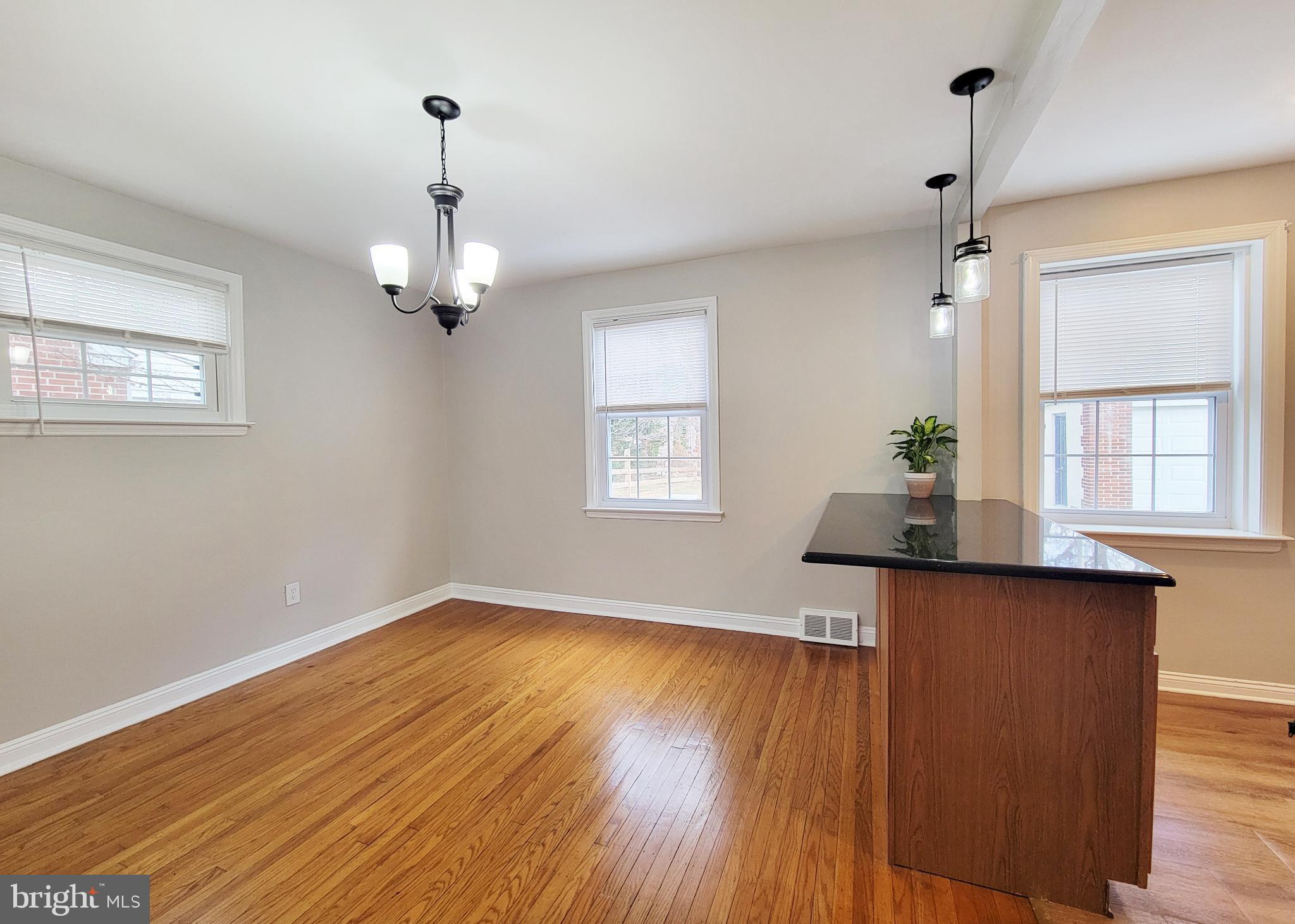 409 Perry Street Ridley Park, PA 19078 - Photo 39 of 66 a view of an empty room with wooden floor and a window