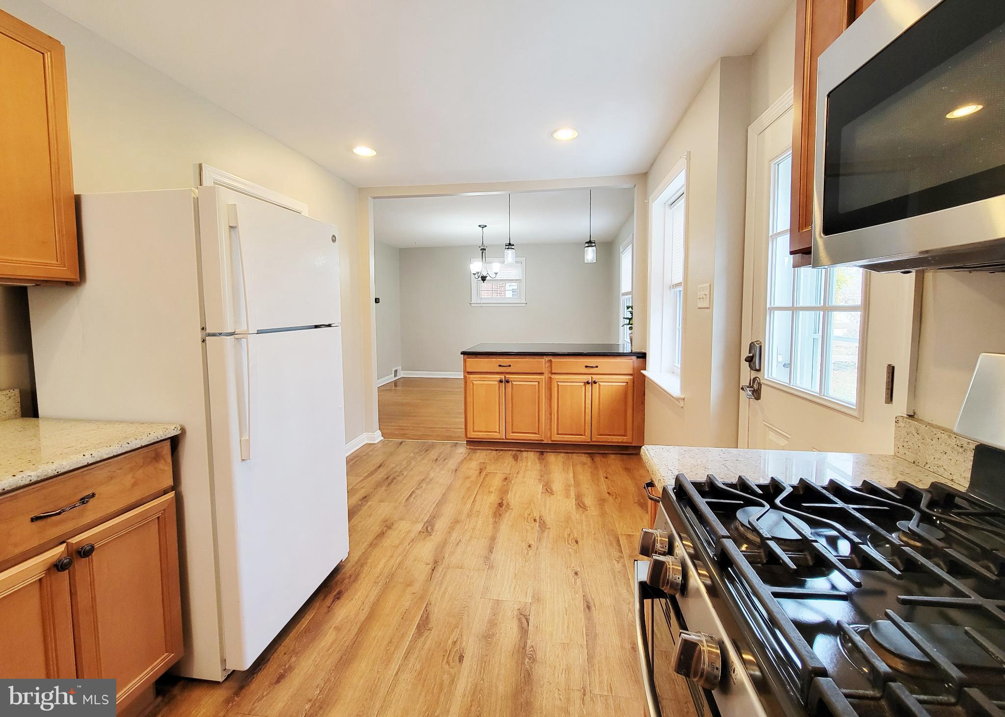409 Perry Street Ridley Park, PA 19078 - Photo 45 of 66 a kitchen with stainless steel appliances granite countertop a refrigerator and a stove top oven