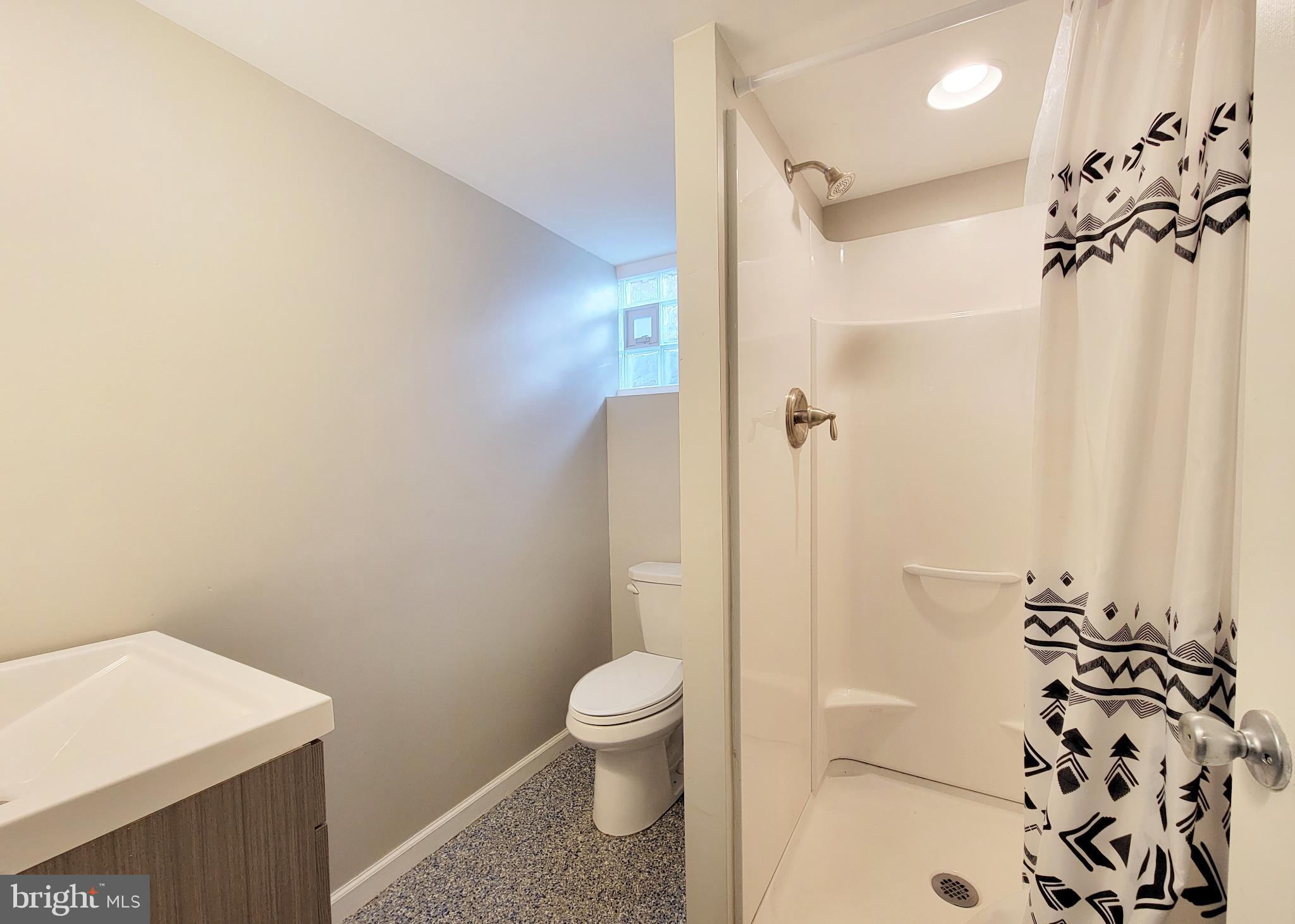 409 Perry Street Ridley Park, PA 19078 - Photo 53 of 66 a bathroom with a toilet and a shower