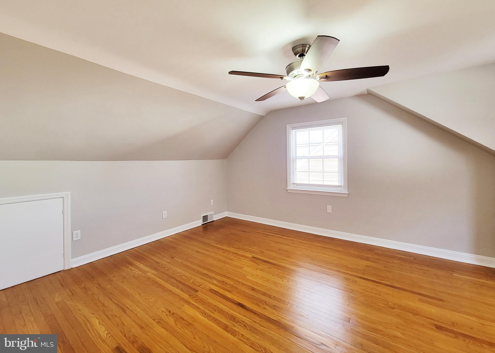 409 Perry Street Ridley Park, PA 19078 - Photo 63 of 66 wooden floor in an empty room with a window