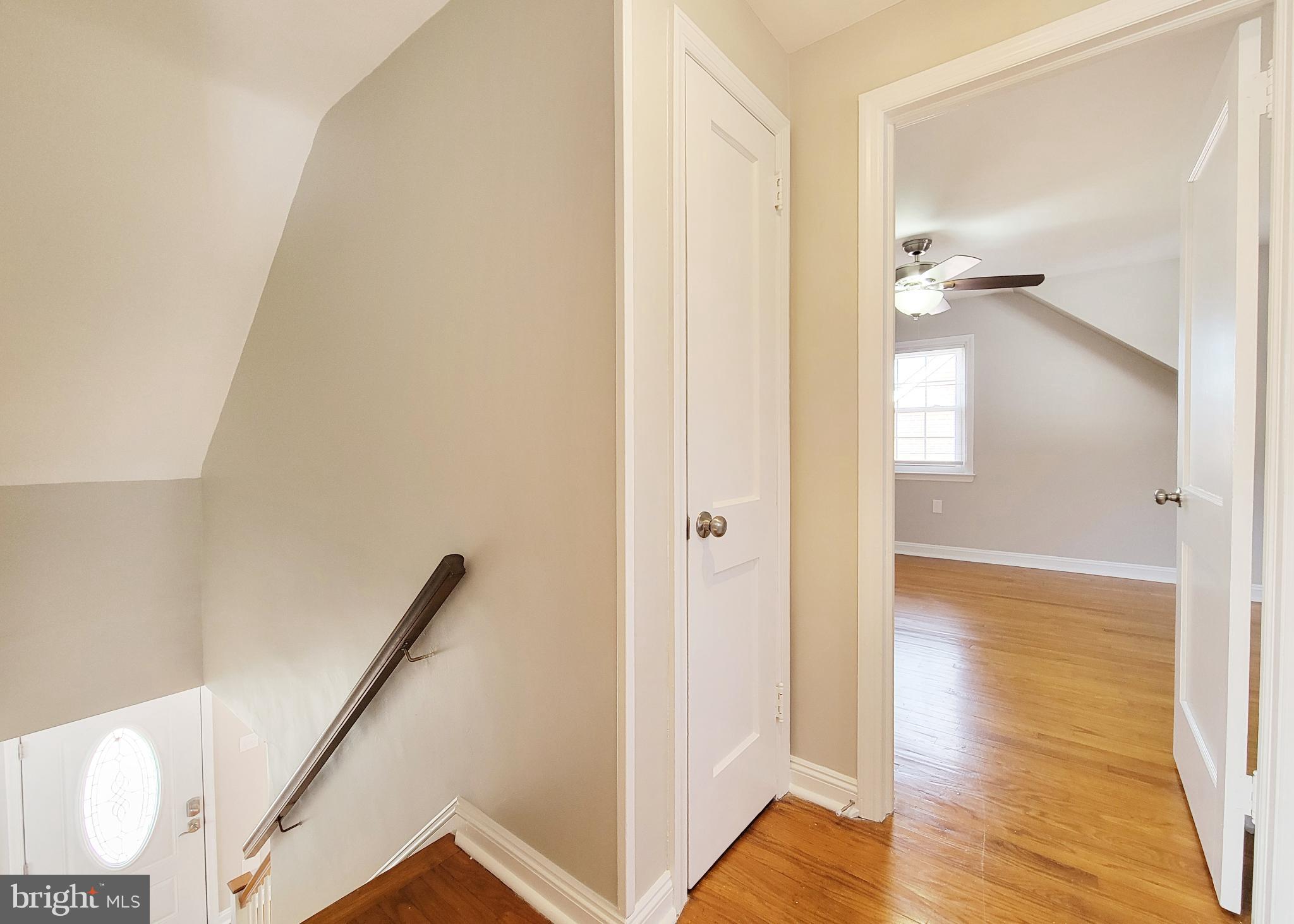 409 Perry Street Ridley Park, PA 19078 - Photo 66 of 66 a view of a hallway with wooden floor and staircase