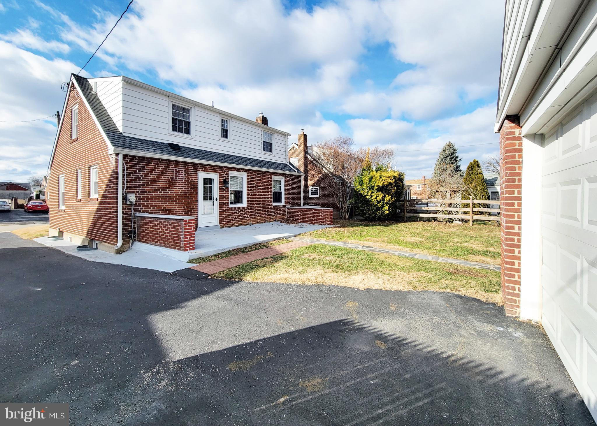 409 Perry Street Ridley Park, PA 19078 - Photo 7 of 66 a view of a house with a big yard and large tree