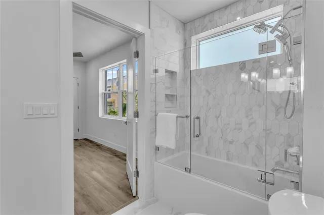 a bathroom with a bathtub and a shower