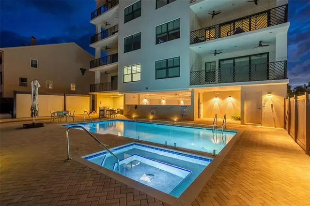 a view of a swimming pool with seating area