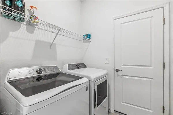 a utility room with dryer and washer