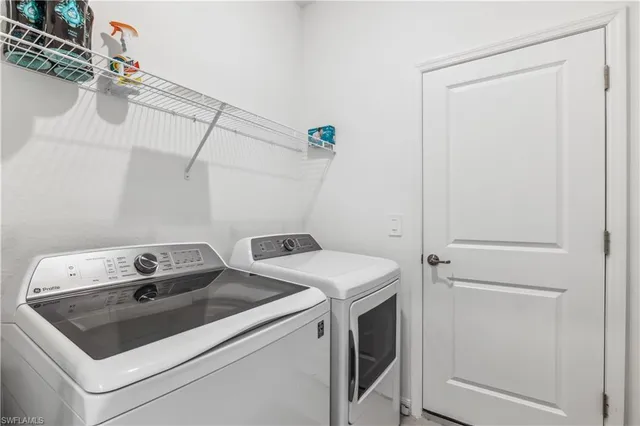 a utility room with dryer and washer
