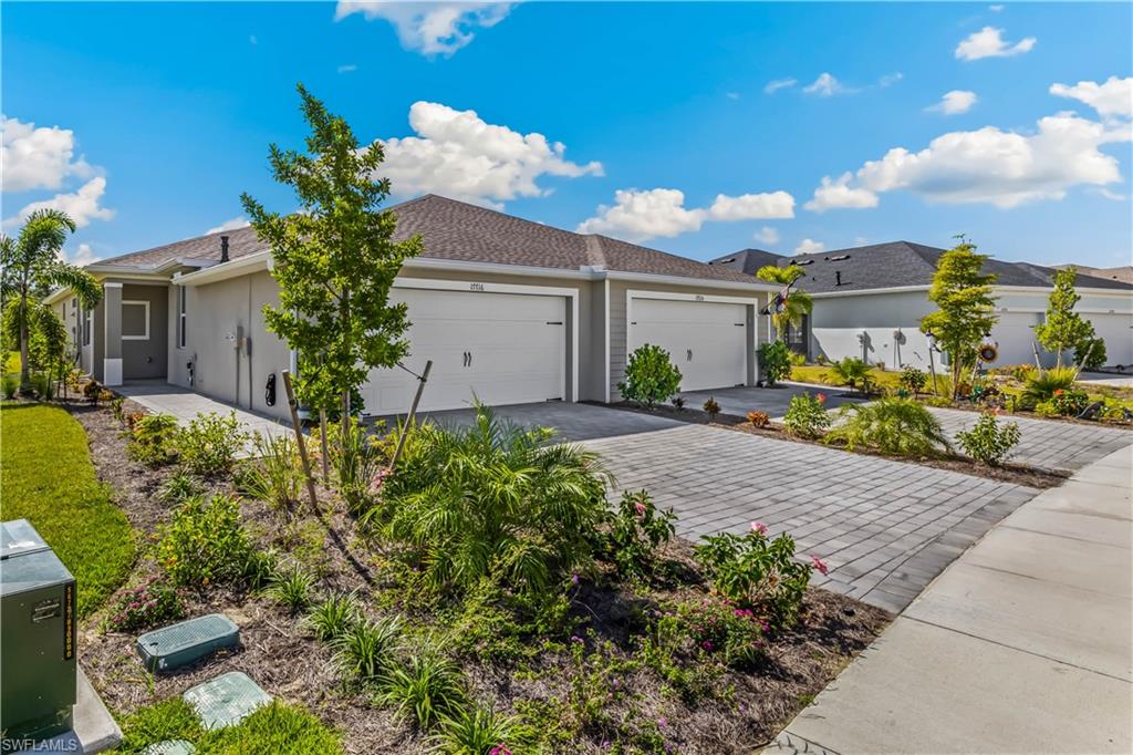 17716 Palmetto Pass Lane Babcock Ranch, FL 33982 - Photo 19 of 20 a house view with a garden space