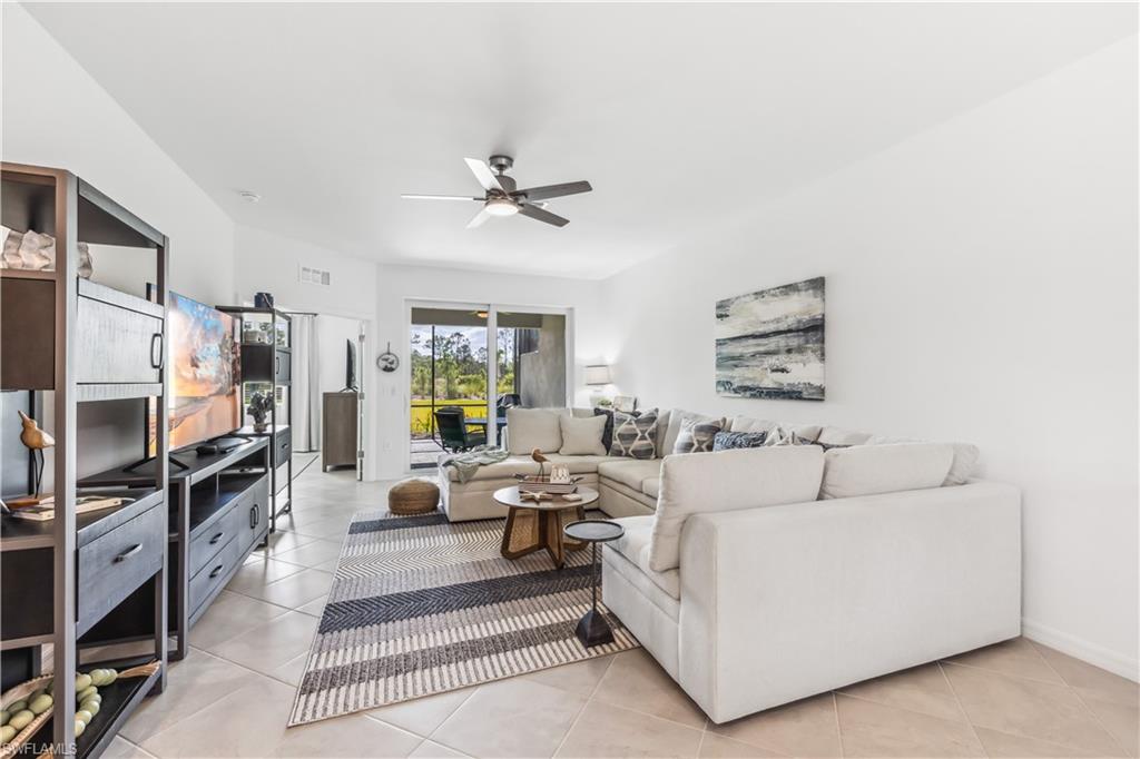 17716 Palmetto Pass Lane Babcock Ranch, FL 33982 - Photo 5 of 20 a living room with furniture a rug and a window