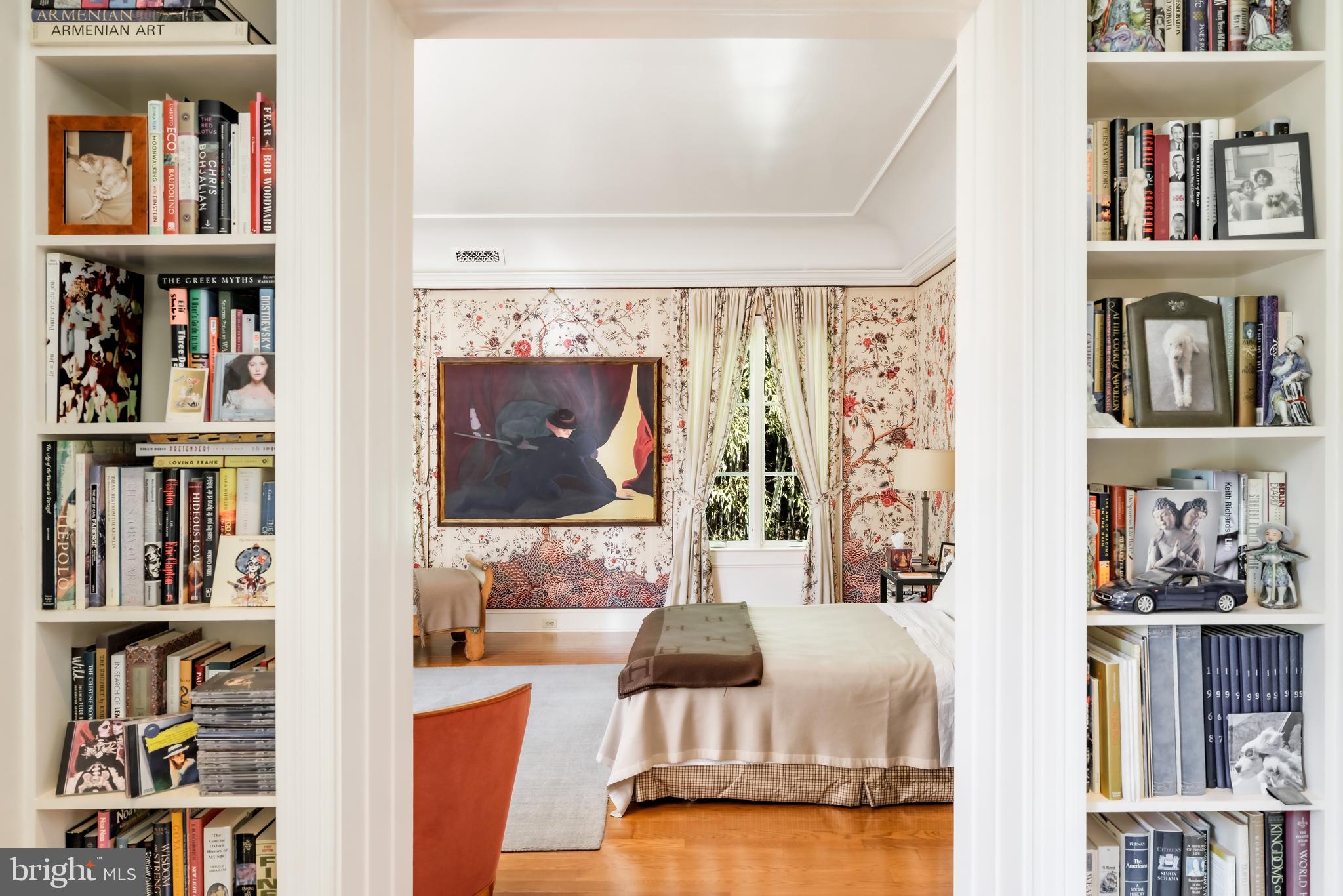 2740 Chain Bridge Road Northwest Washington, DC 20016 - Photo 24 of 50 a living room with lots of furniture and a book shelf