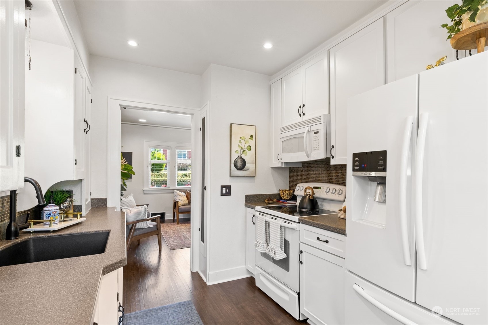 1232 Donovan Lane Everett, WA 98201 - Photo 9 of 34 a kitchen with stainless steel appliances a sink a stove a refrigerator and cabinets