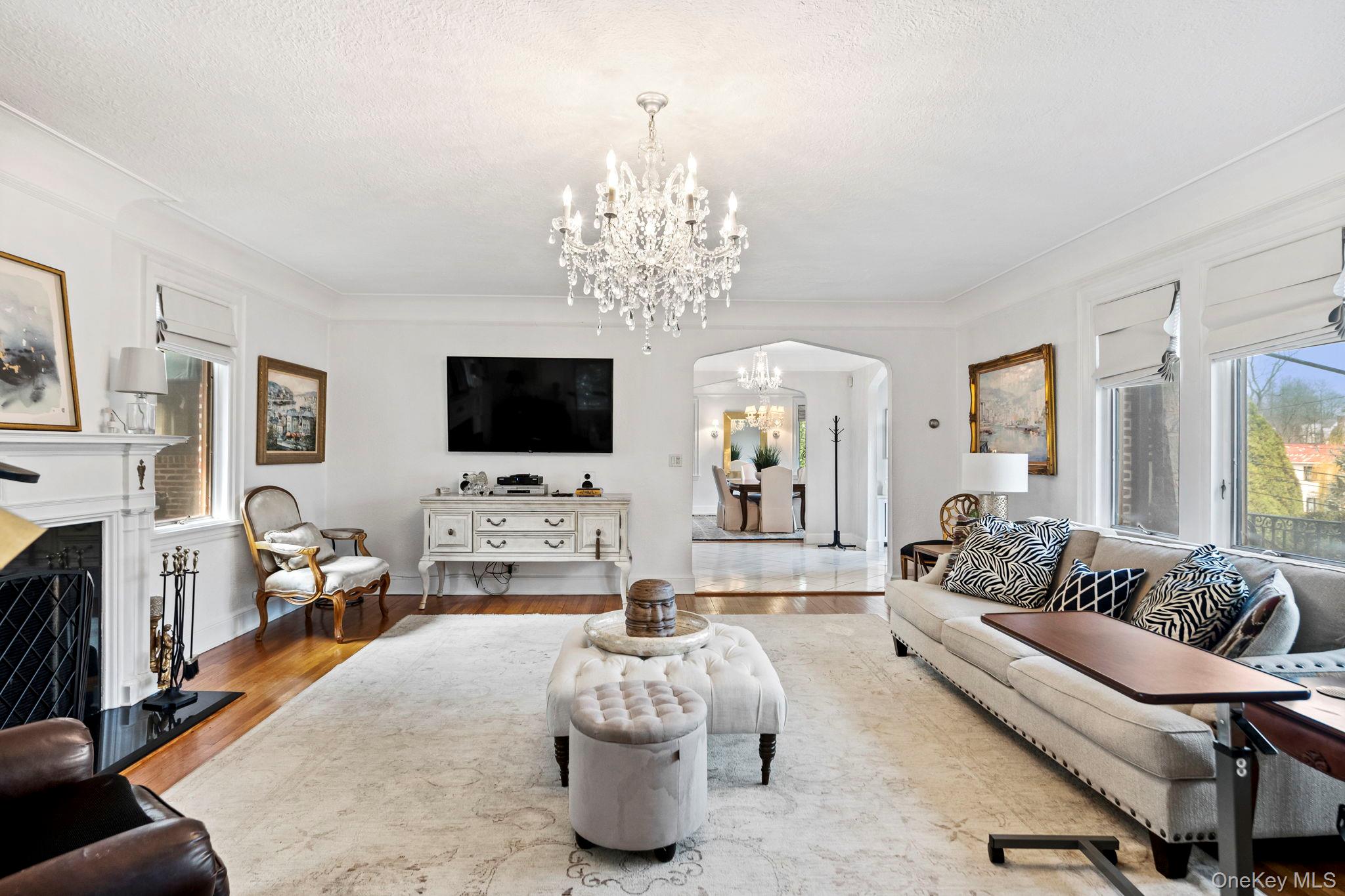 44 Fenimore Road New Rochelle, NY 10804 - Photo 6 of 46 a living room with fireplace furniture and a flat screen tv
