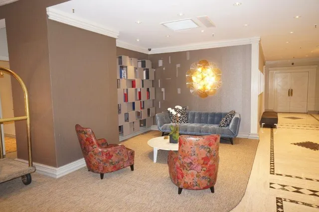 a living room with a couch and a mirror