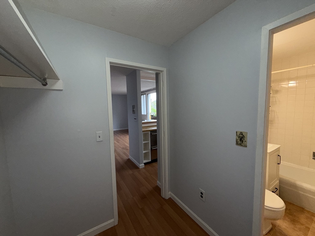 12 Inman Street, Unit 23 Cambridge, MA 02139 - Photo 8 of 14 a bathroom with a toilet and a shower