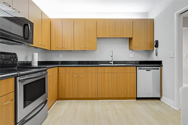 a view of livingroom with furniture and wooden floor