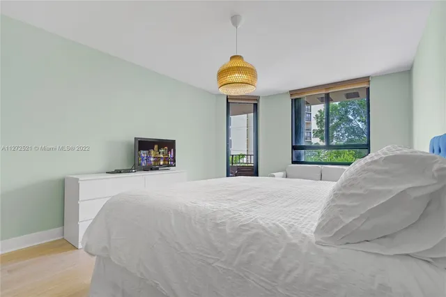 a bathroom with a sink double vanity granite tub shower and a mirror