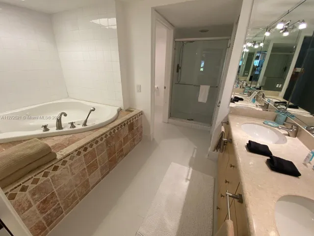 a bathroom with a toilet a sink and a window