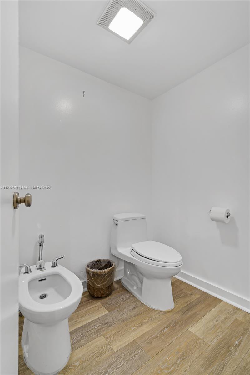 101 Crandon Boulevard, Unit 267 Key Biscayne, FL 33149 - Photo 24 of 57 a bathroom with a toilet a sink and a window