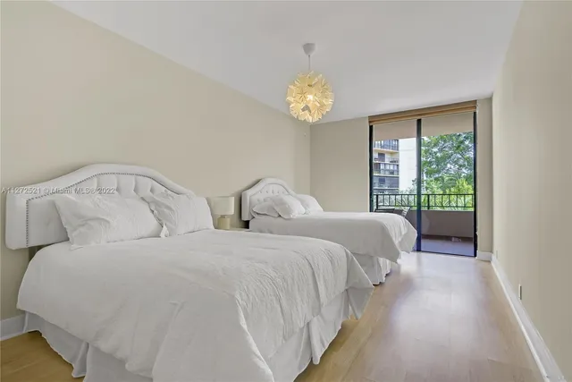 a bedroom with a bed and a chair