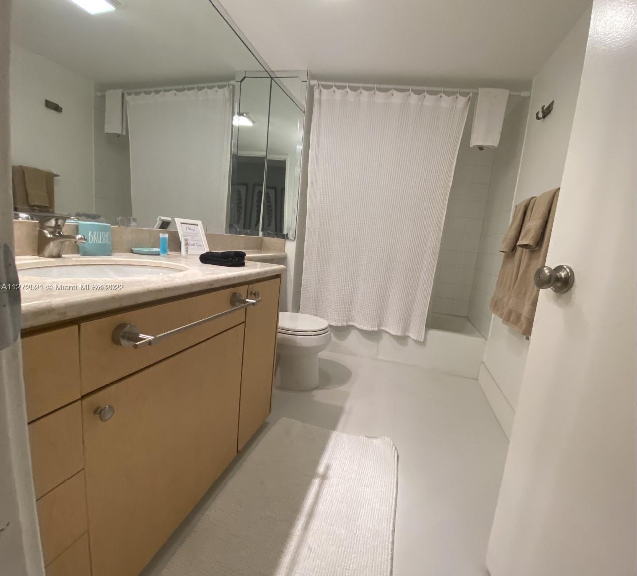 101 Crandon Boulevard, Unit 267 Key Biscayne, FL 33149 - Photo 29 of 57 a bathroom with a sink a toilet and shower