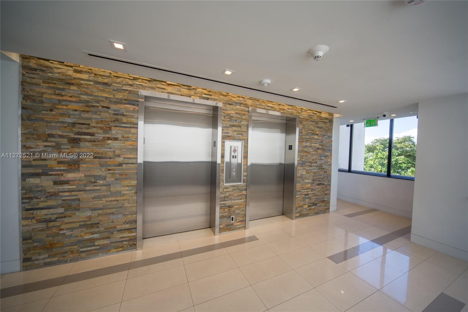 101 Crandon Boulevard, Unit 267 Key Biscayne, FL 33149 - Photo 3 of 57 a view of empty room with a fireplace and shower