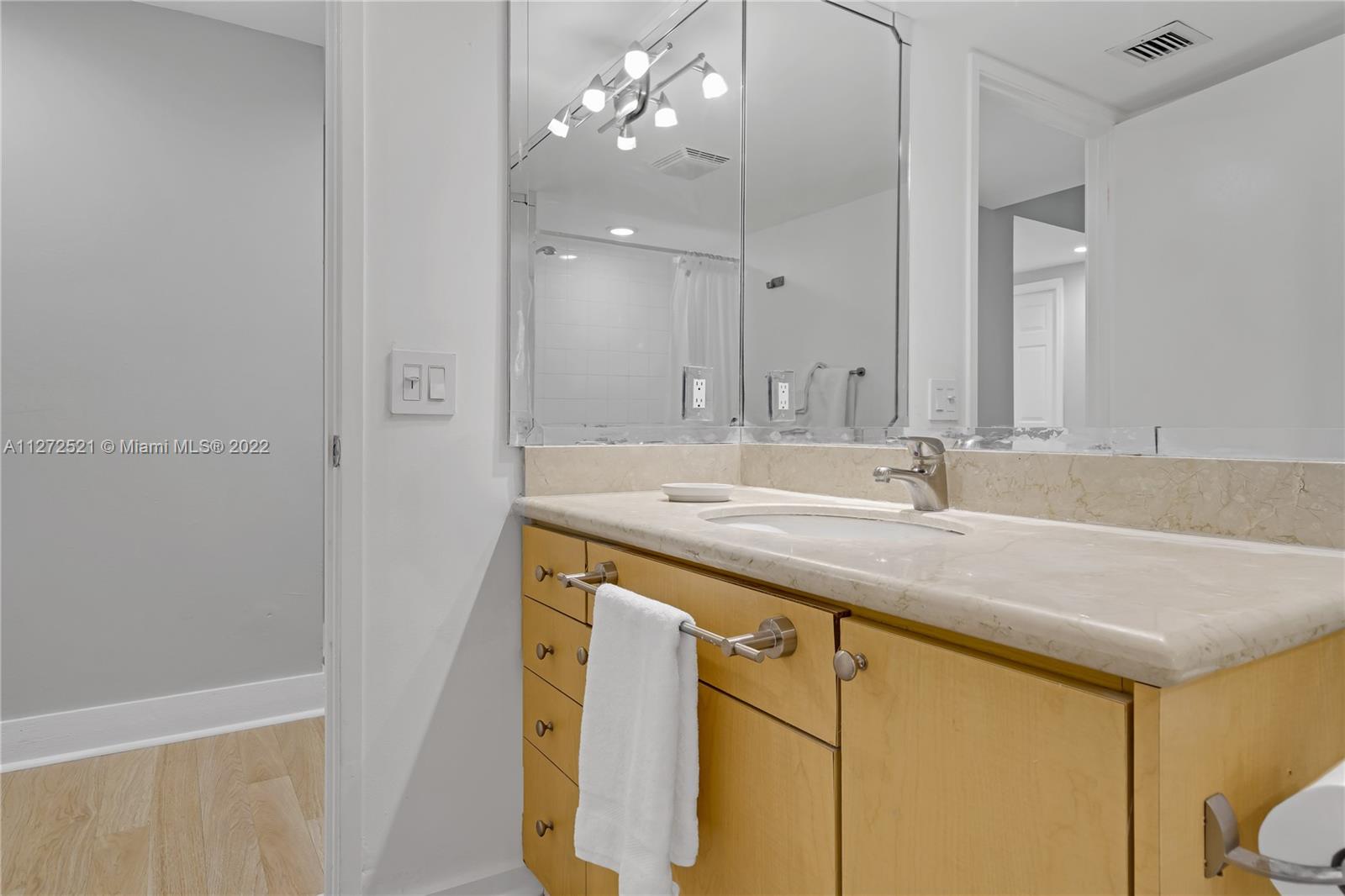 101 Crandon Boulevard, Unit 267 Key Biscayne, FL 33149 - Photo 31 of 57 a bathroom with a sink and a mirror