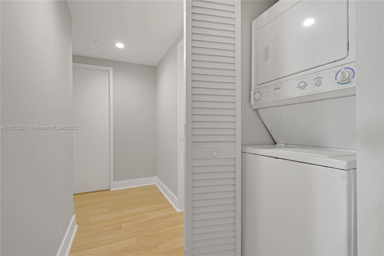 101 Crandon Boulevard, Unit 267 Key Biscayne, FL 33149 - Photo 32 of 57 a utility room with dryer and washer