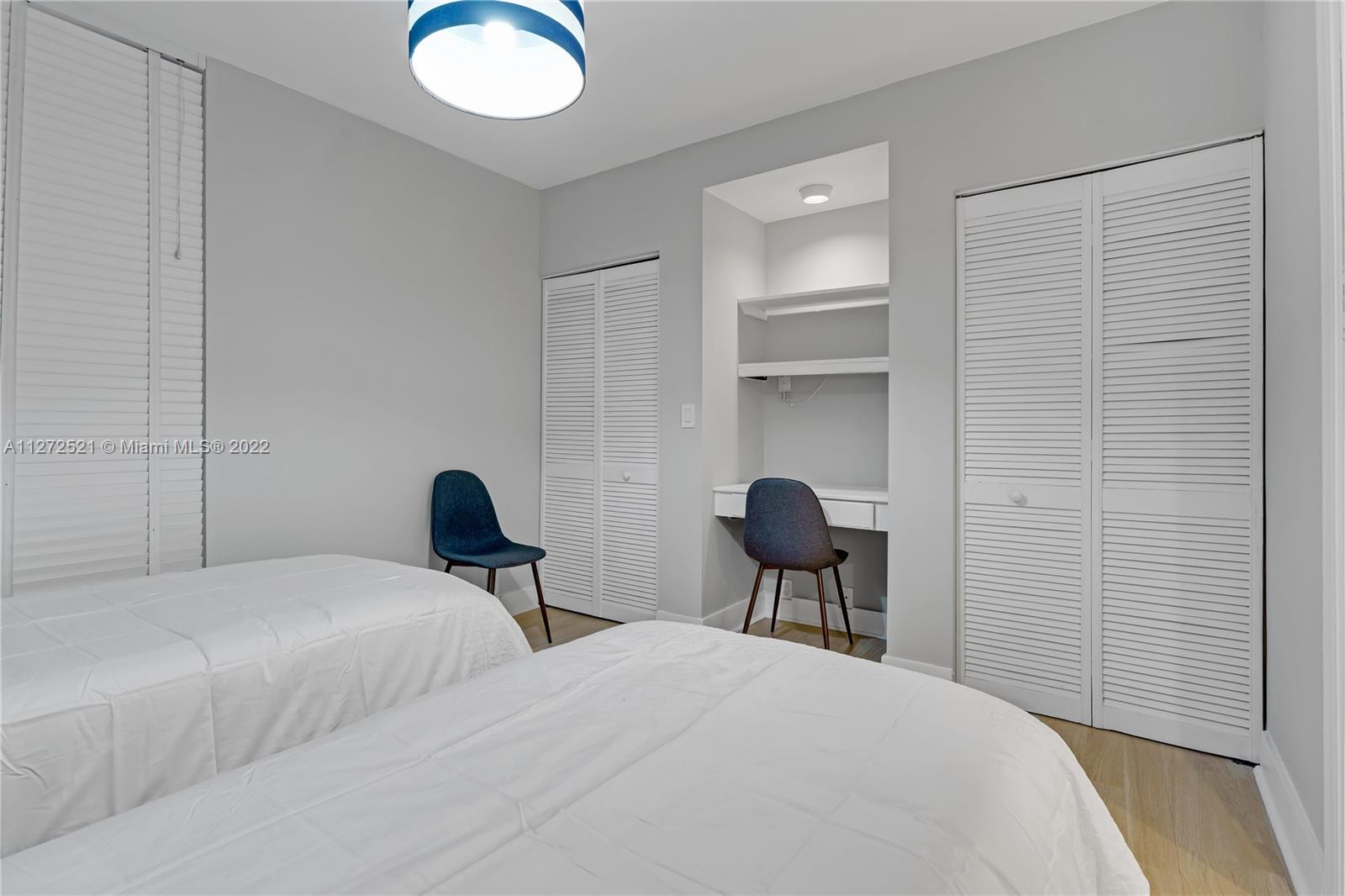 101 Crandon Boulevard, Unit 267 Key Biscayne, FL 33149 - Photo 35 of 57 a bedroom with a bed and a chair