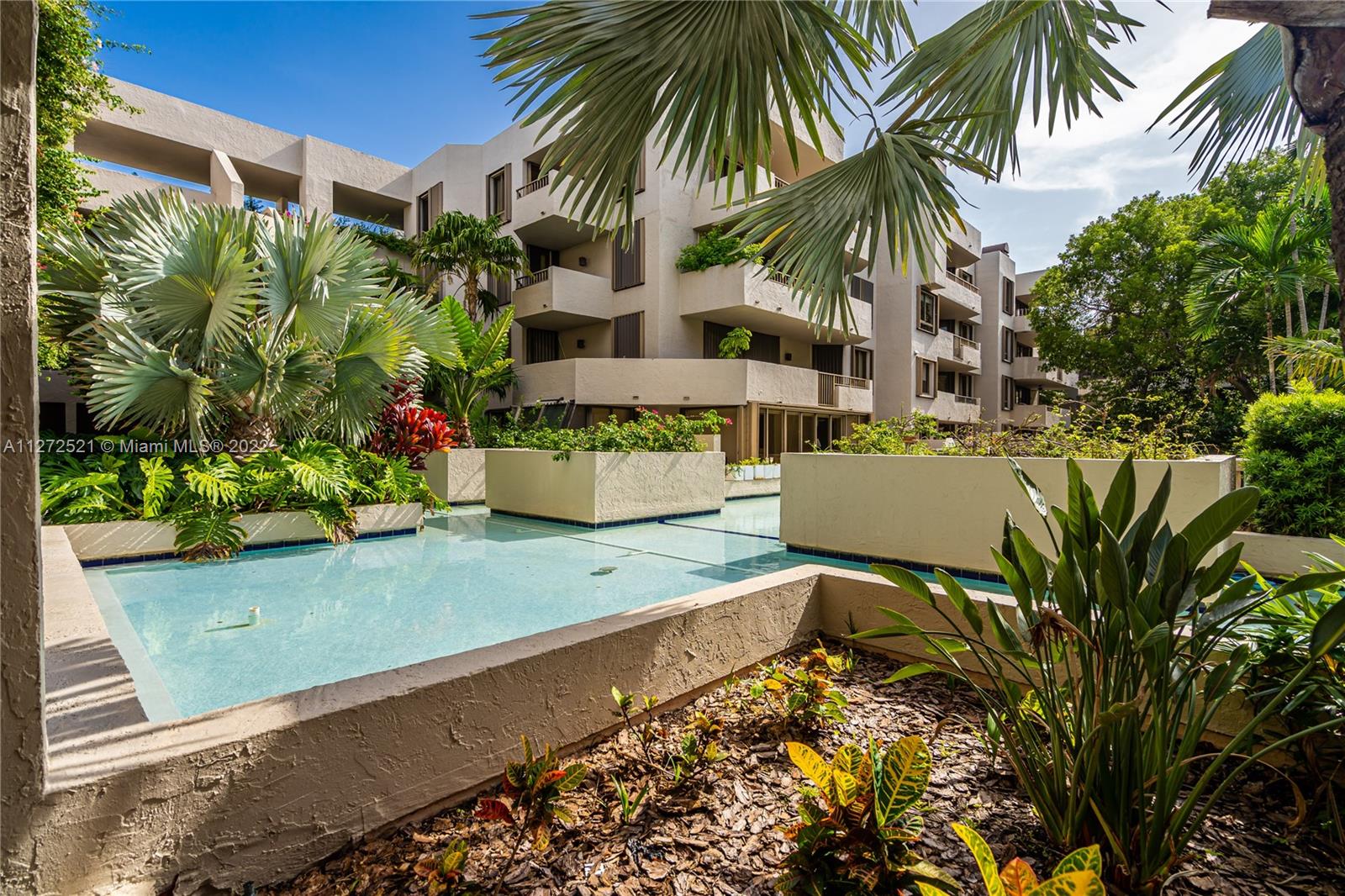 101 Crandon Boulevard, Unit 267 Key Biscayne, FL 33149 - Photo 42 of 57 a view of a backyard with plants