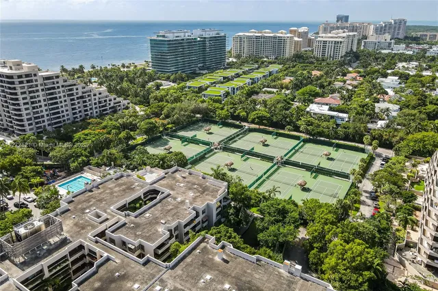 a view of building with yard and staircase