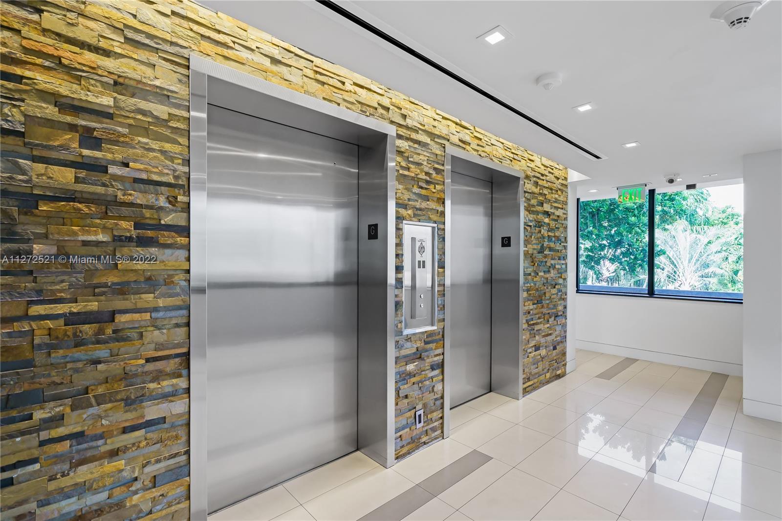 101 Crandon Boulevard, Unit 267 Key Biscayne, FL 33149 - Photo 52 of 57 a view of entryway with a hallway