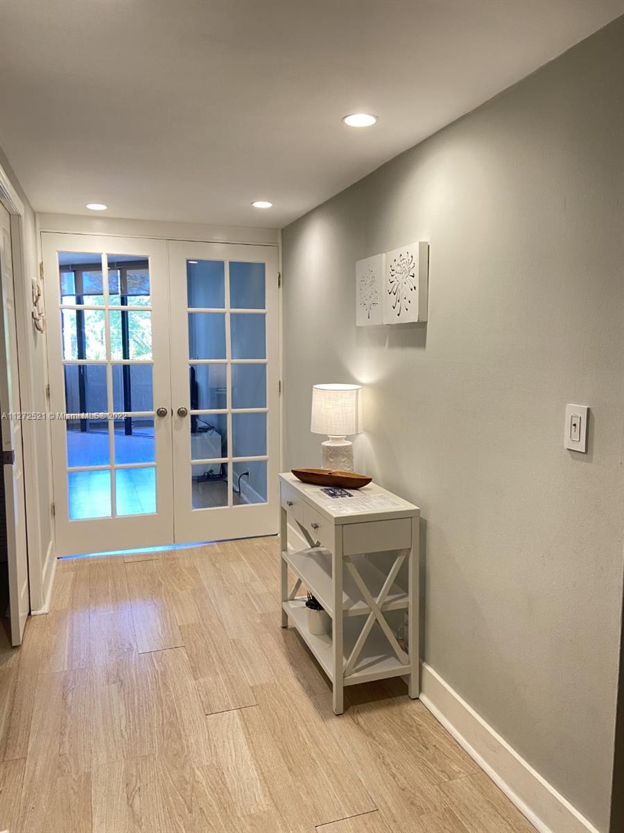 101 Crandon Boulevard, Unit 267 Key Biscayne, FL 33149 - Photo 56 of 57 a view of a livingroom with furniture and an empty room