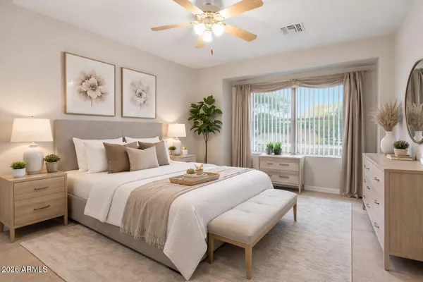 a bedroom with a bed dresser chandelier and a window